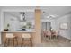 Bright kitchen area with breakfast bar seating and adjacent dining space at 3627 Arch St, Orlando, FL 32808