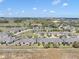 Aerial perspective of homes nestled in a scenic community with mature trees and landscaping at 3640 Solana Cir # A, Clermont, FL 34711