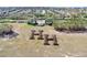 Aerial view of community entrance with landscaping feature, surrounding homes, and neighborhood streets at 3640 Solana Cir # A, Clermont, FL 34711