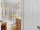 Bright bathroom featuring a shower-tub combo, vanity with sink, and a decorative shower curtain at 3640 Solana Cir # A, Clermont, FL 34711