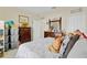 Bedroom featuring a large dresser, neutral paint, and a comfortable bed at 3640 Solana Cir # A, Clermont, FL 34711