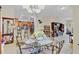 Open concept dining area with barstool seating and seamless access to the kitchen and living room at 3640 Solana Cir # A, Clermont, FL 34711