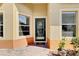 Welcoming entryway with a decorative front door, sidelight windows, and brick pavers at 3640 Solana Cir # A, Clermont, FL 34711