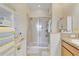Bathroom featuring tiled shower with glass enclosure and tiled floors at 3640 Solana Cir # A, Clermont, FL 34711