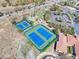 Aerial view of the community tennis courts and landscaping at Heritage Hills in Clermont, Florida at 3640 Solana Cir # A, Clermont, FL 34711