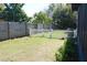 Spacious backyard featuring a combination of wood and white picket fencing at 3708 Merryweather Dr, Orlando, FL 32812