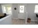 Light and airy foyer with a white door, neutral decor, and ample natural light at 3708 Merryweather Dr, Orlando, FL 32812