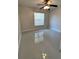 An empty bedroom with a window and ceiling fan at 3719 Madbury Cir, Lakeland, FL 33810