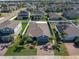 An aerial view of a well-maintained single-story home with lush landscaping and a fenced backyard at 3861 Hanworth Loop, Sanford, FL 32773