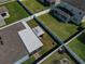 An aerial view of a home's fenced backyard and green lawn in a residential neighborhood at 3861 Hanworth Loop, Sanford, FL 32773