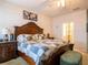 Spacious bedroom with decorative bed frame and en-suite bathroom at 3861 Hanworth Loop, Sanford, FL 32773