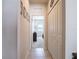 Hallway with tile flooring and closet space leads into a bedroom at 3861 Hanworth Loop, Sanford, FL 32773