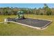 A vibrant community playground with slides and swings amidst a lush green landscape, ideal for Gathering fun at 3861 Hanworth Loop, Sanford, FL 32773