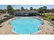 An inviting community swimming pool is surrounded by palm trees and lounge chairs, perfect for relaxation and recreation at 3861 Hanworth Loop, Sanford, FL 32773