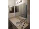 Bathroom vanity with a single sink and a large mirror with lighting at 4275 Perkinshire Ln # 204, Orlando, FL 32822