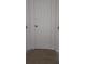 Hallway featuring white doors at 4275 Perkinshire Ln # 204, Orlando, FL 32822