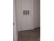 Hallway with doors and a cabinet with vents at 4275 Perkinshire Ln # 204, Orlando, FL 32822