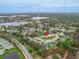 Expansive aerial view of a well-maintained neighborhood featuring lush landscaping, lakes, and attractive single-Gathering homes at 460 Quail Hill Dr, Debary, FL 32713