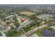 Aerial view of the home in its neighborhood with a highlighted red arrow at 460 Quail Hill Dr, Debary, FL 32713