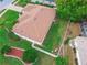 Aerial view shows the lawn, roof, patio, and fenced in backyard of the property at 460 Quail Hill Dr, Debary, FL 32713