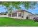 Well-maintained backyard featuring a white fence and a screened-in porch on the home at 460 Quail Hill Dr, Debary, FL 32713