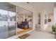 Covered patio with a view into the living room and a well-manicured yard at 460 Quail Hill Dr, Debary, FL 32713