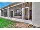 View of the home's screened-in porch and the door leading into the property at 460 Quail Hill Dr, Debary, FL 32713