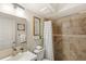 Neutral bathroom with a glass enclosed shower, framed art, and a modern vanity at 4713 Capri Pl # 190, Orlando, FL 32811