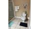 Bathroom with toilet, shower, towel rack, tiled floors and decorative print at 5000 Cayview Ave # 10108, Orlando, FL 32819