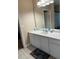 Bathroom featuring a white vanity, a large mirror, and neutral wall color at 5000 Cayview Ave # 10108, Orlando, FL 32819