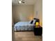 Cozy bedroom with neutral walls, ceiling fan, and side table with lamp at 5000 Cayview Ave # 10108, Orlando, FL 32819