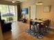 Bright dining area with wood-look tile floors and a sliding glass door to the balcony at 5000 Cayview Ave # 10108, Orlando, FL 32819