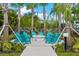 Cozy outdoor fire pit surrounded by Adirondack chairs and lush landscaping at 5000 Cayview Ave # 10108, Orlando, FL 32819