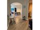 Hallway view of dining area and desk workspace featuring wood look tile floors at 5000 Cayview Ave # 10108, Orlando, FL 32819