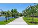 Scenic path along the water, lined with trees, offers a tranquil environment at 5000 Cayview Ave # 10108, Orlando, FL 32819