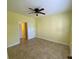 Bedroom with neutral walls, plush carpeting, ceiling fan and closet space for storage at 5105 City St # 817, Orlando, FL 32839