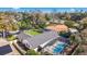 An aerial view of a home featuring a screened-in pool and well-maintained backyard at 5140 Honeynut Ln, Windermere, FL 34786