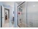 Bathroom with a shower stall and glass door at 5140 Honeynut Ln, Windermere, FL 34786