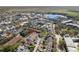 Overhead shot of a home in a community setting, showcasing its proximity to a tranquil lake and local establishments at 520 Longmeadow St, Celebration, FL 34747