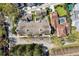 Aerial view of a neighborhood featuring luxury townhomes, private pools, garages, and lush landscaping; Gathering-friendly at 520 Longmeadow St, Celebration, FL 34747