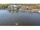 Aerial image of a waterfront property, reflecting the surrounding buildings and scenery in the calm water at 520 Longmeadow St, Celebration, FL 34747