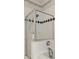 Shower with glass enclosure and black diamond pattern detail at 520 Longmeadow St, Celebration, FL 34747