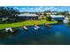 Aerial view of waterfront apartments with boat docks and lush green lawns at 524 Georgetown Dr # A, Casselberry, FL 32707