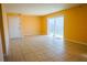 Bright living room with tiled floor and large sliding glass doors to let in plenty of natural light at 524 Georgetown Dr # A, Casselberry, FL 32707