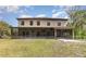 Rear exterior view showcasing the two-story home with a screened-in patio at 6346 Dallas Blvd, Orlando, FL 32833