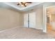 Neutral bedroom with carpet, ceiling fan, and spacious closet perfect for customization at 6346 Dallas Blvd, Orlando, FL 32833