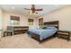 Comfortable bedroom with modern furniture, a ceiling fan, and natural light at 6346 Dallas Blvd, Orlando, FL 32833