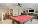 Spacious game room features a pool table, ceiling fans, and ample seating for entertaining guests at 6346 Dallas Blvd, Orlando, FL 32833