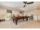 Game room featuring a billiard table with a ceiling fan and window light at 6346 Dallas Blvd, Orlando, FL 32833