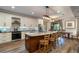 Modern kitchen featuring a center island, stainless steel appliances, and an adjacent dining area at 6346 Dallas Blvd, Orlando, FL 32833